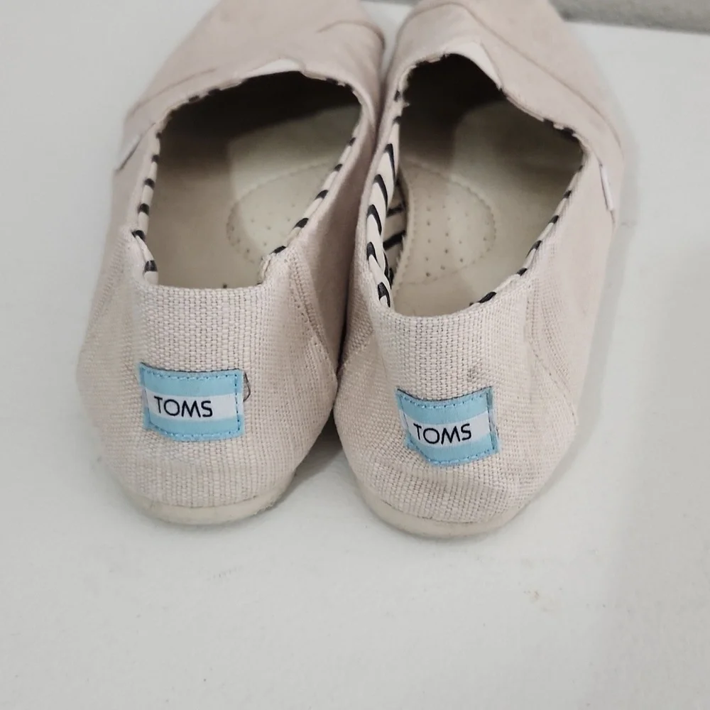 TOMS Shoes Size 9.5 Cream Canvas Slip-On has spots flaws